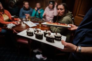 Afternoon tea served aboard the historic yacht Faith on Lake Te Anau